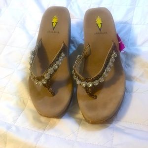 Volatile wedge shoes with diamond detail.